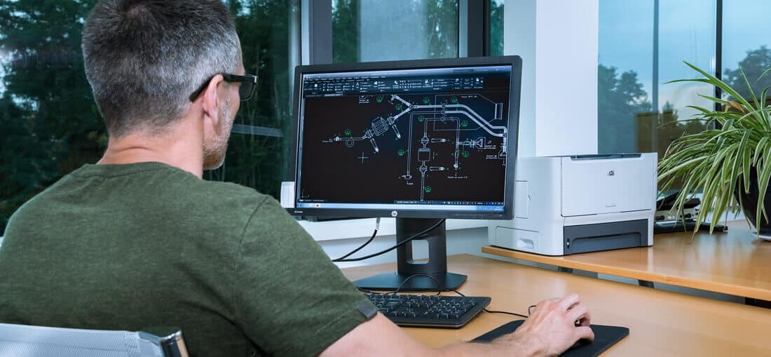 Photograph of someone making a technical drawing in a design office