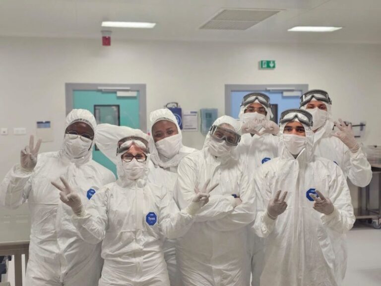 Photo of the aseptic group production team in the clean room.